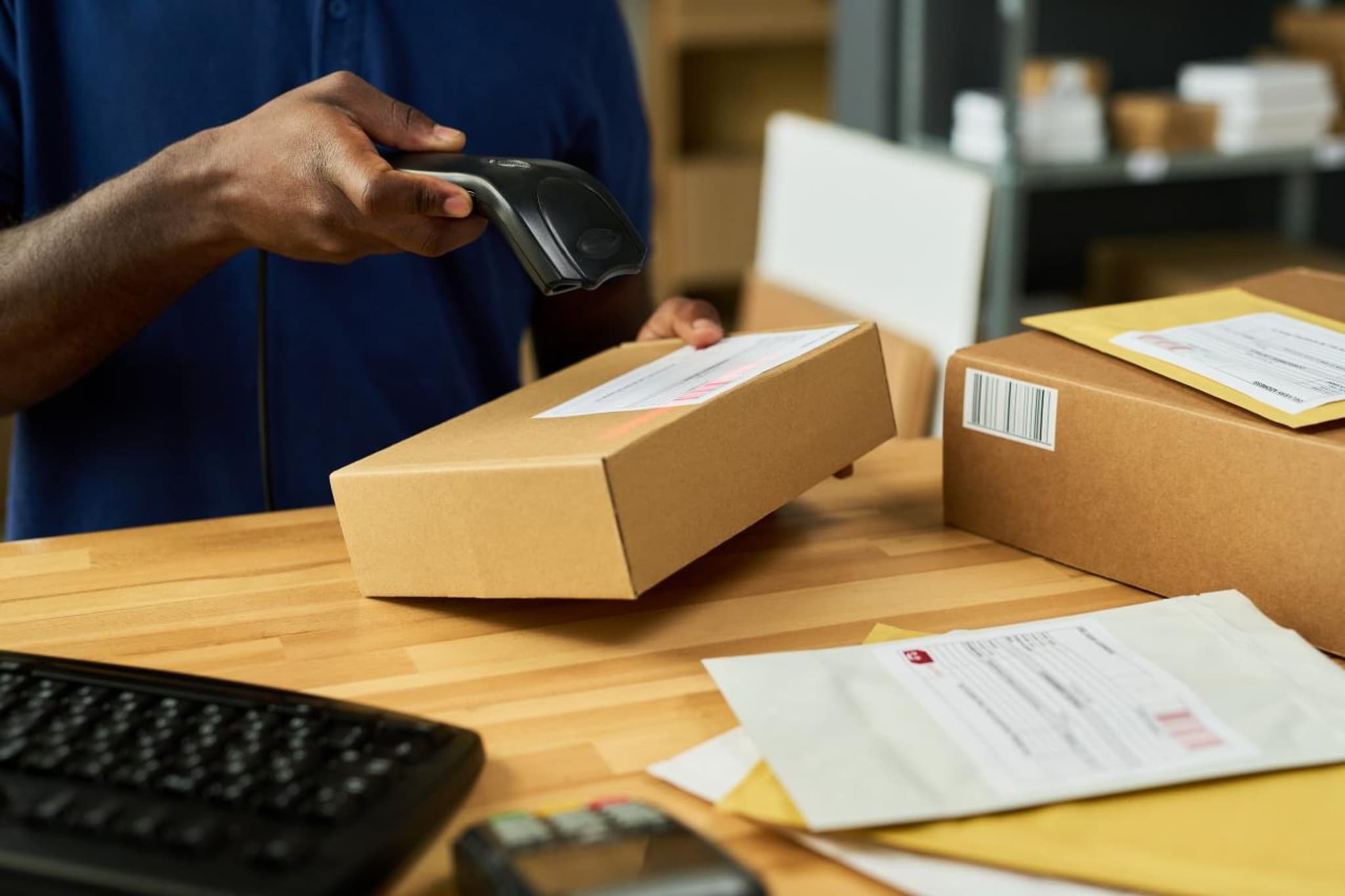 A parcel being scanned and booked in for our tracked postal service
